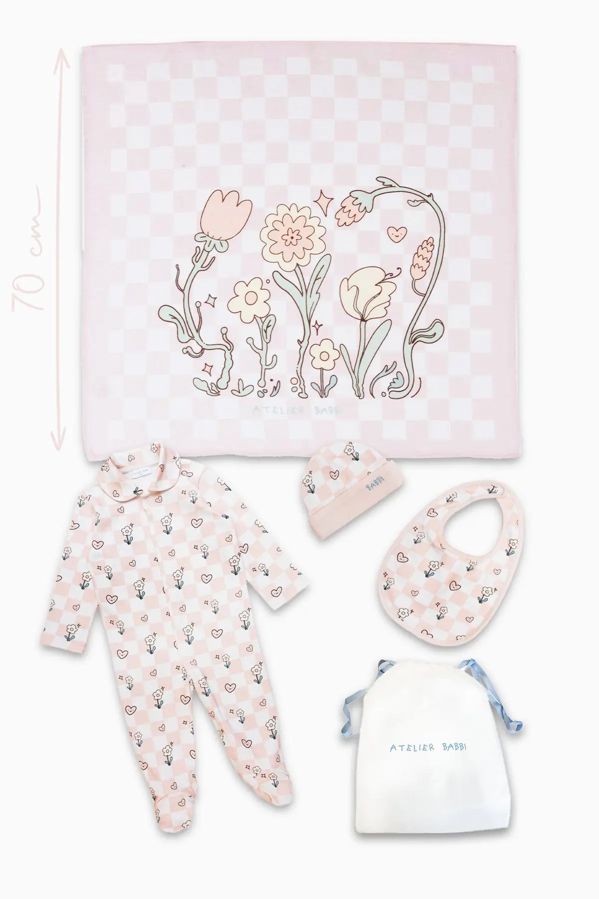 Flat lay of checkered newborn gift set including jumpsuit, hat, bib, and swaddle made from 100% organic cotton