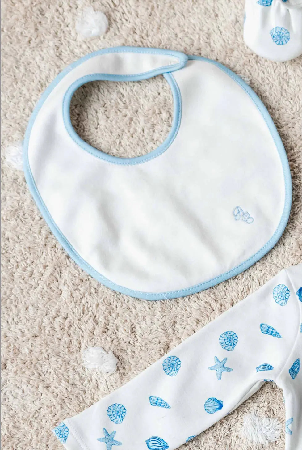 Sea Shell patterned newborn hat and bib set, ideal for daily baby essentials