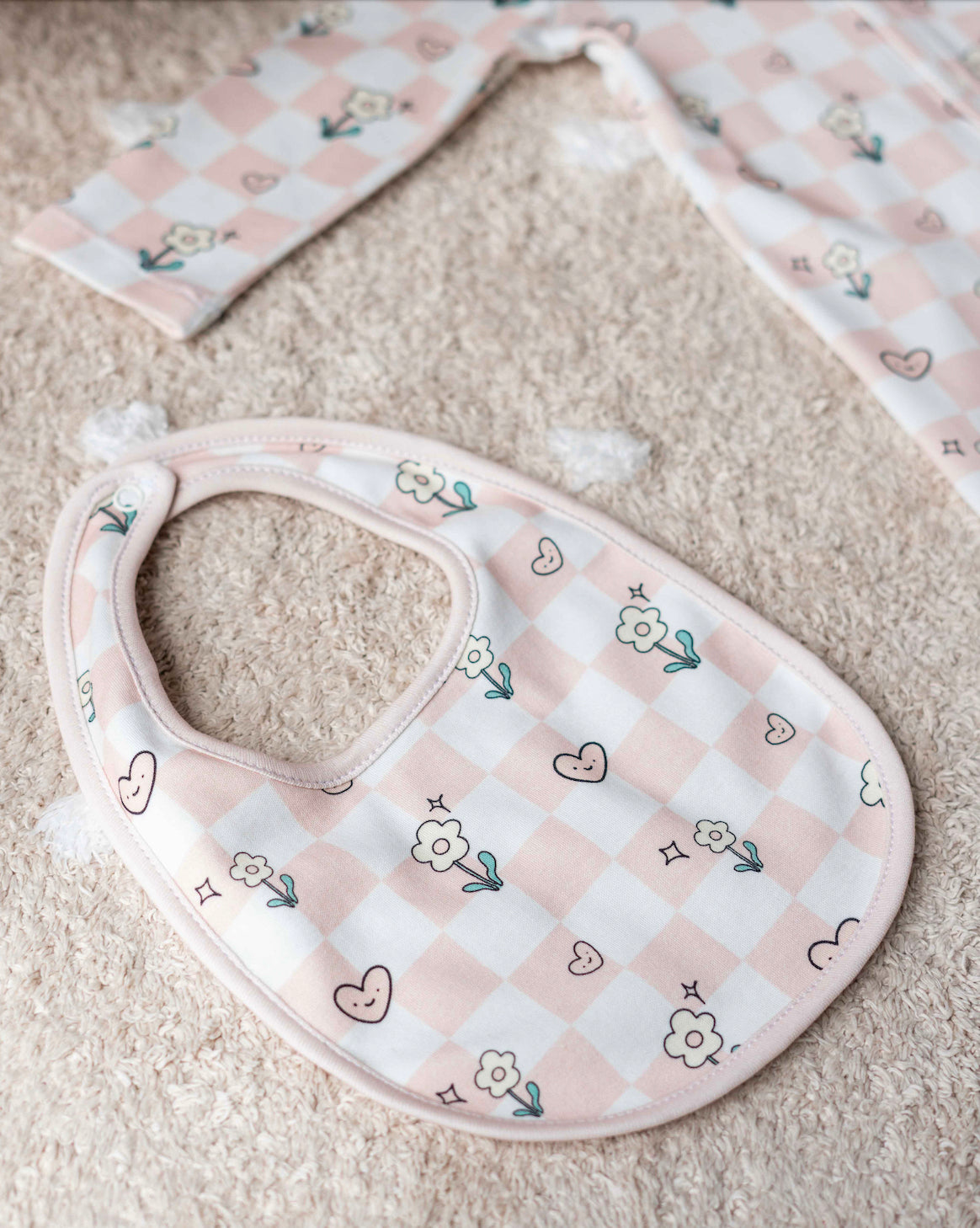 Matching checkered hat and bib for newborns, crafted with GOTS-certified natural dyes
