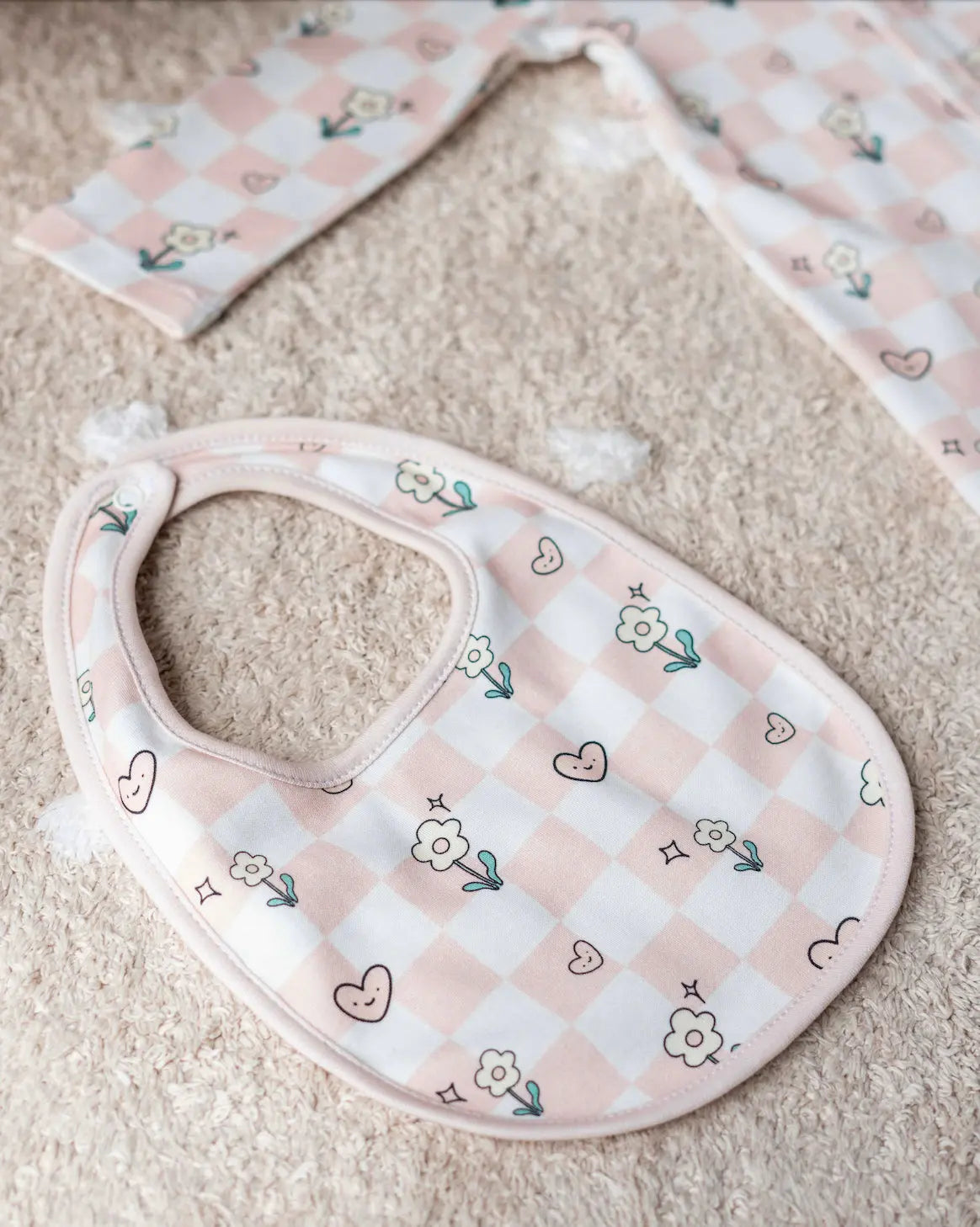 Matching checkered hat and bib for newborns, crafted with GOTS-certified natural dyes