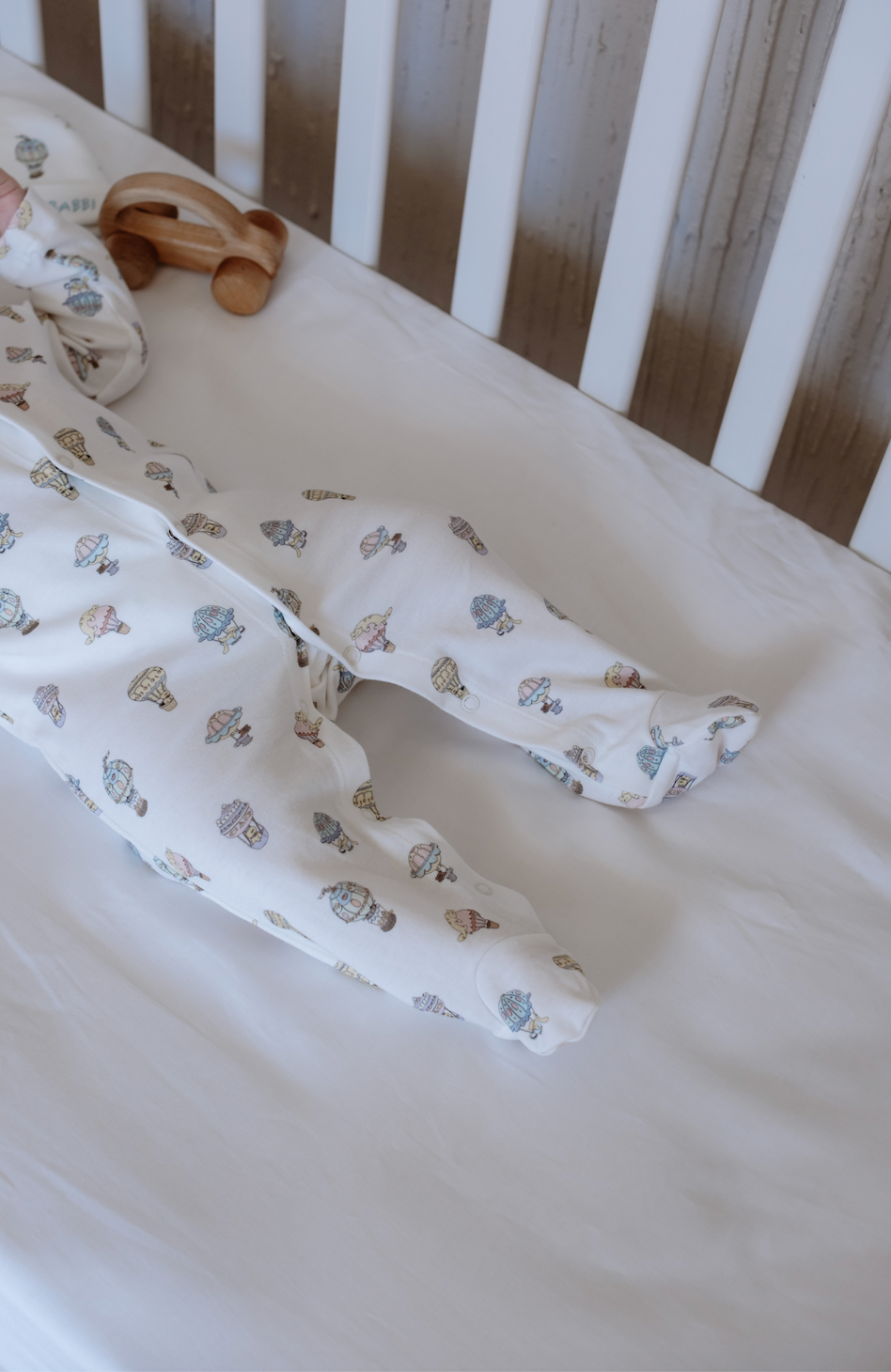 Cozy infant bodysuit with balloon illustrations