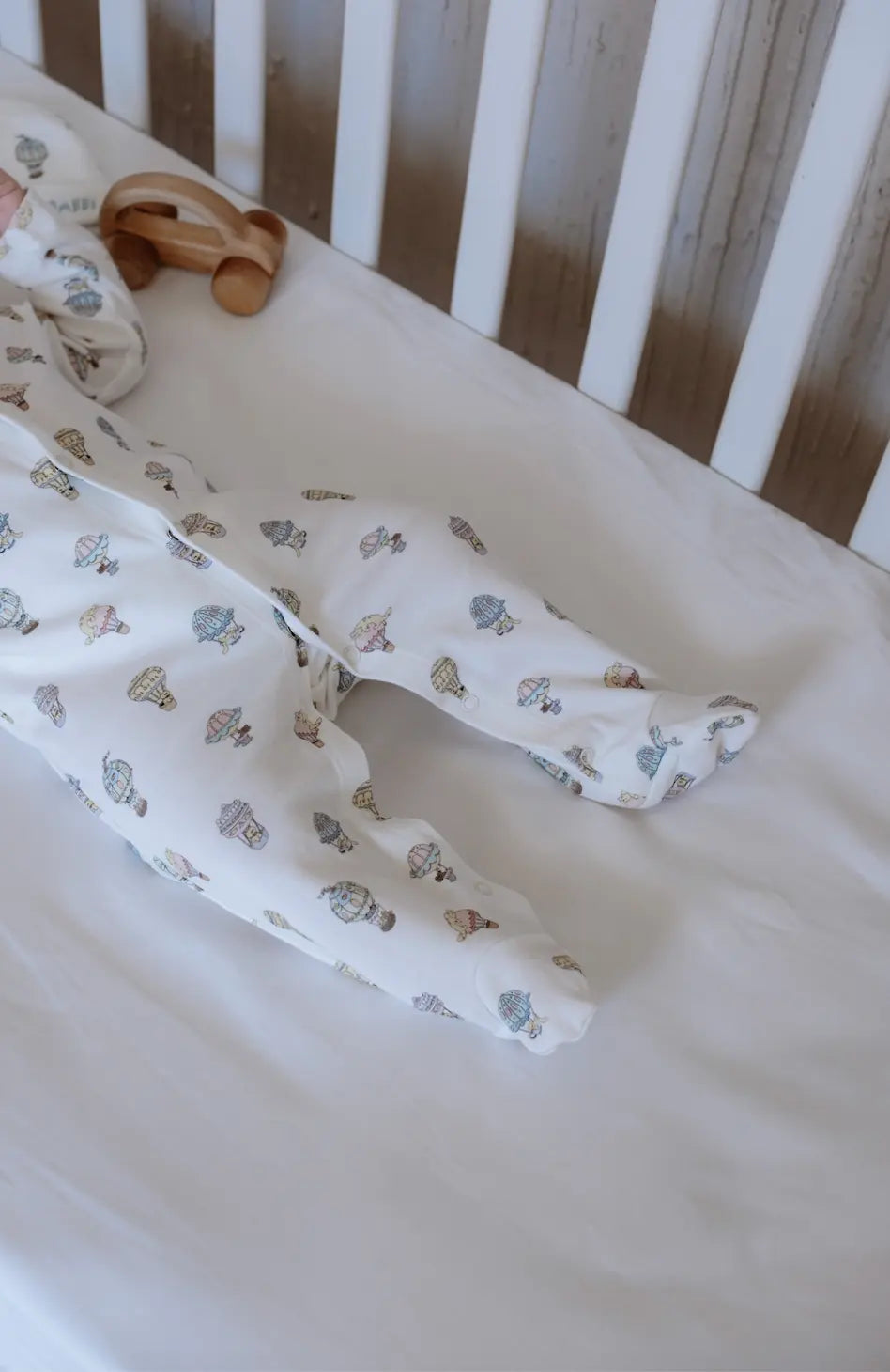 Cozy infant bodysuit with balloon illustrations