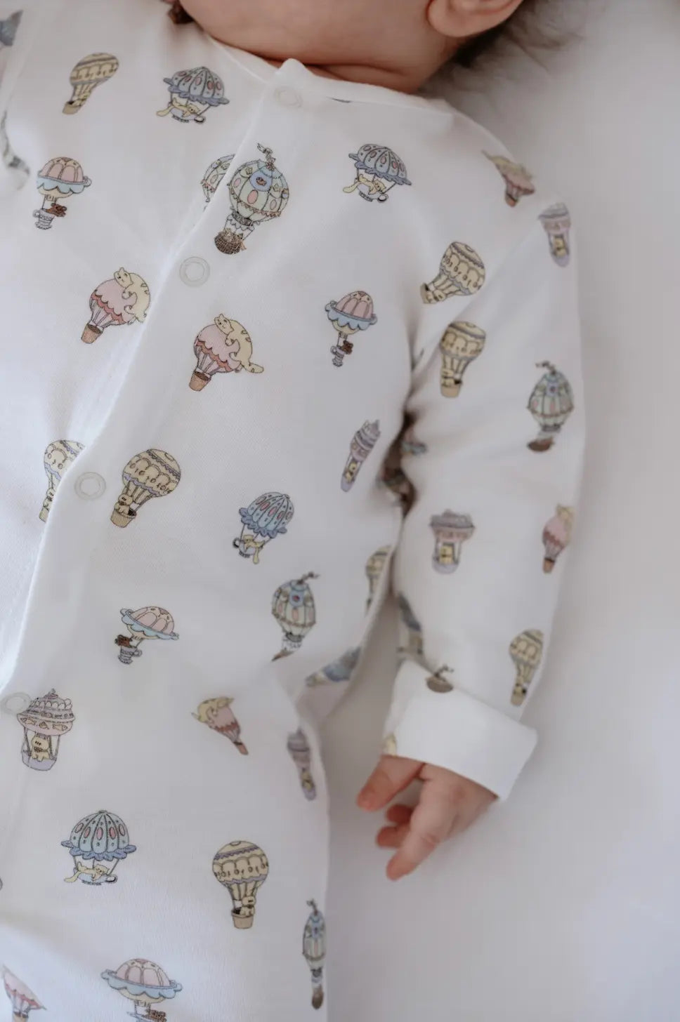 Organic cotton newborn onesie with balloon theme