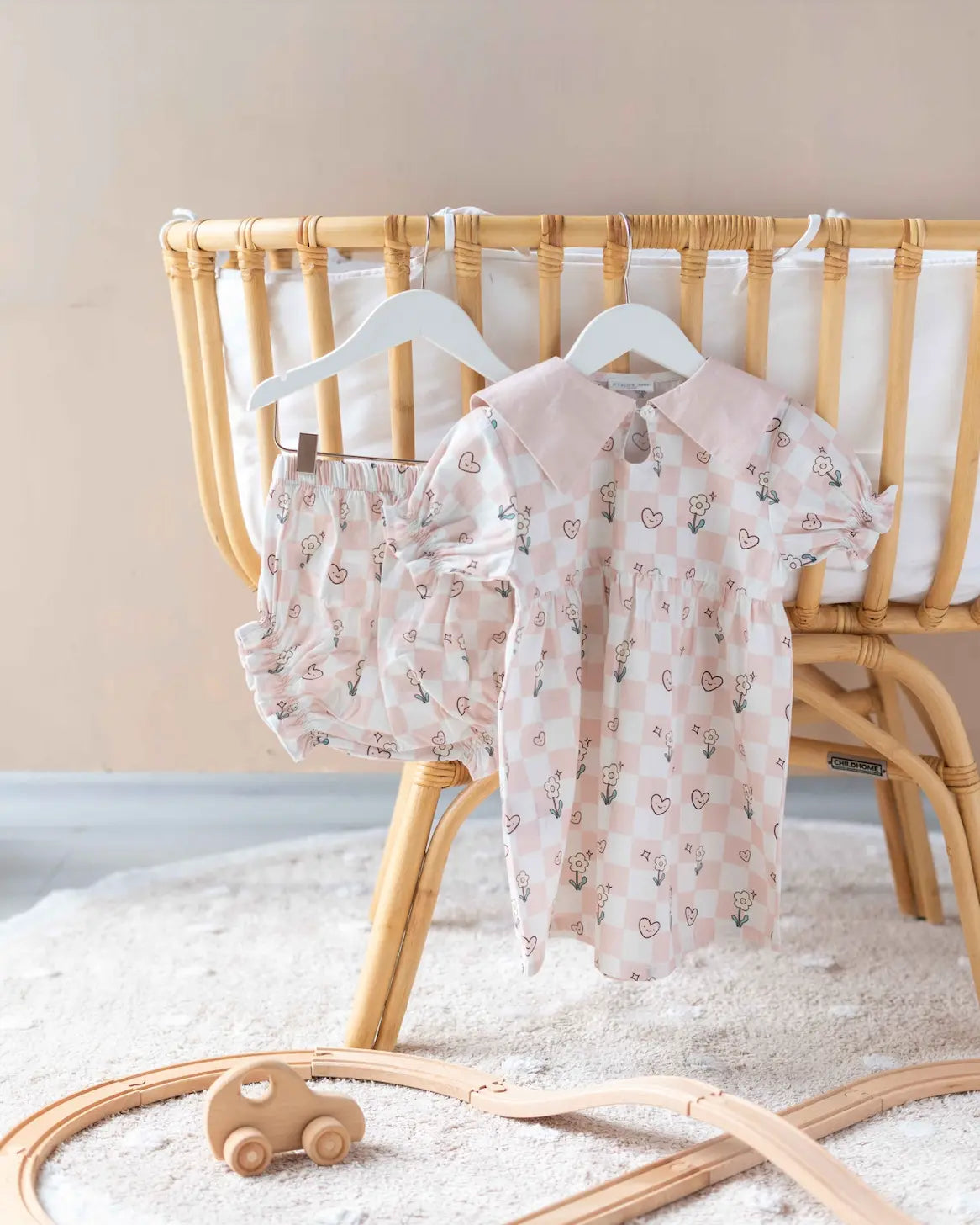 Adorable checkered baby dress with soft cotton fabric, perfect for everyday comfort and style.