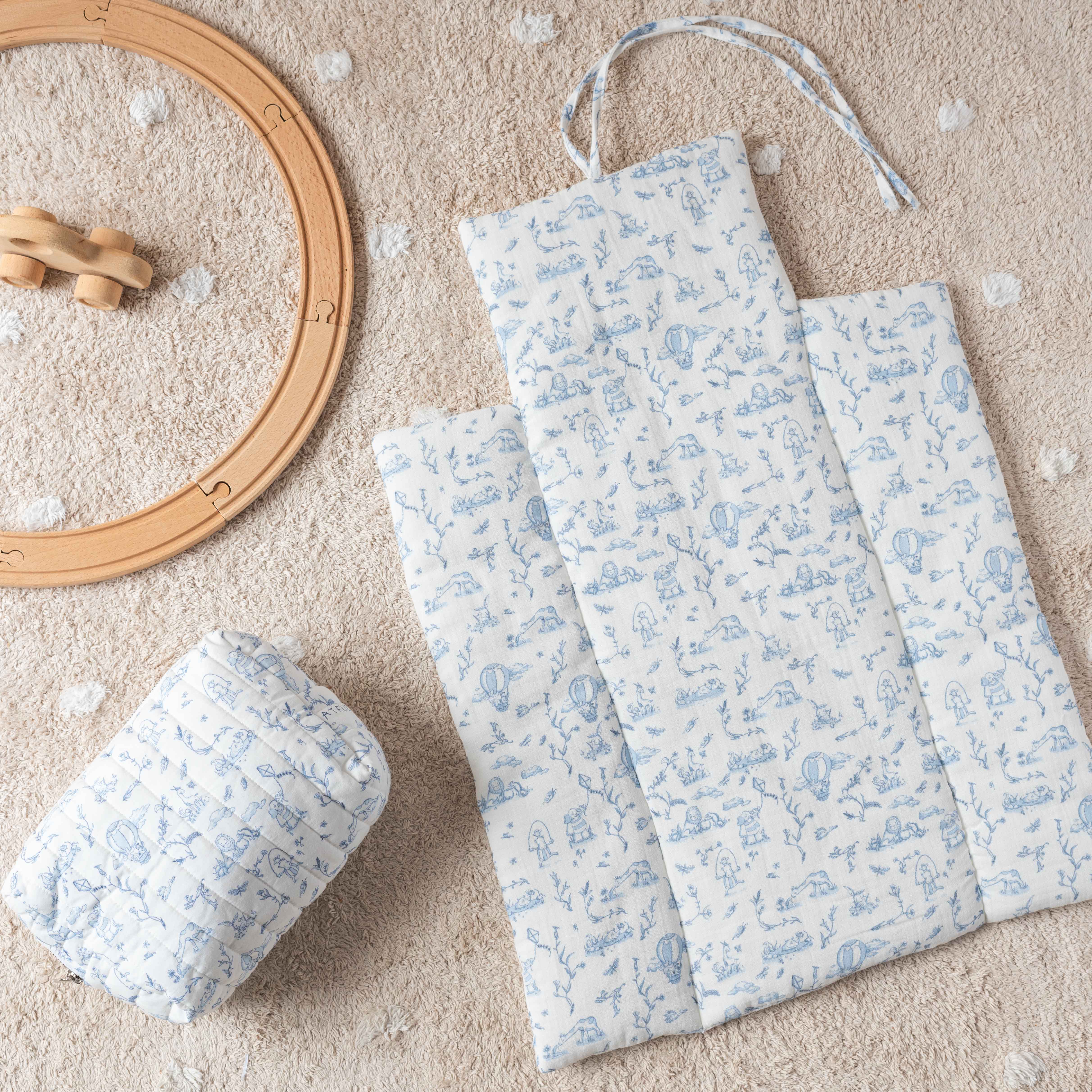 Soft blue diaper changing mat and pouch set with elegant Toile de Jouy design – Atelier Babbi USA baby collection