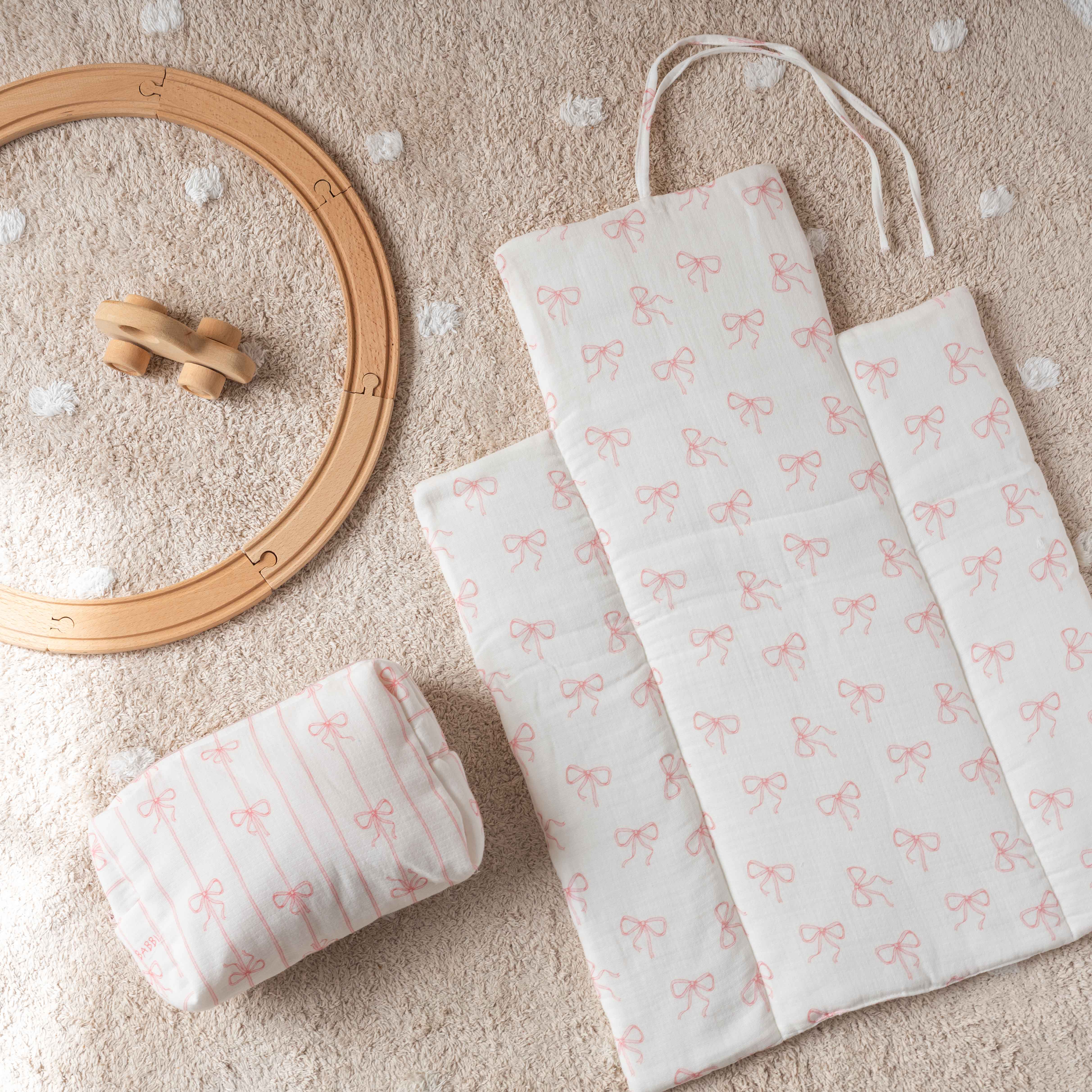 Pink diaper changing set with elegant ribbon motif – soft mat and coordinated pouch – Atelier Babbi USA