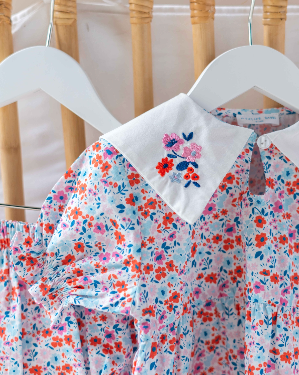 iny Flowers Red baby dress styled for spring and summer occasions.