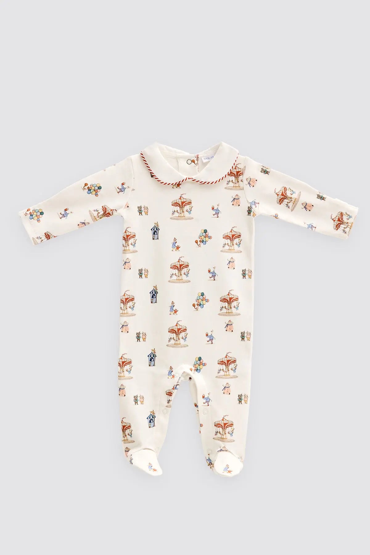 Baby onesie with carousel print on a light gray background