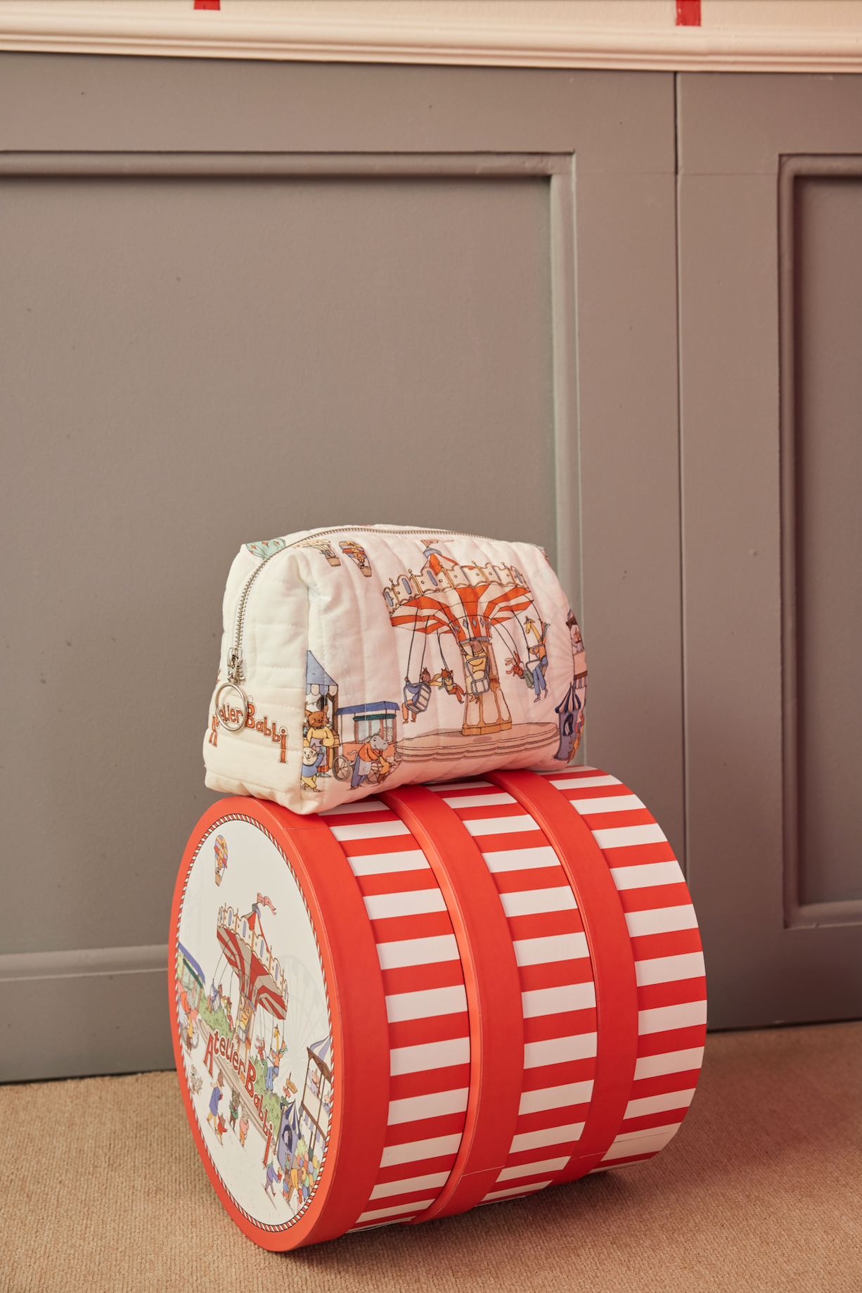 Funfair collection baby diaper pouch with whimsical carnival print, 100% cotton, zip closure.