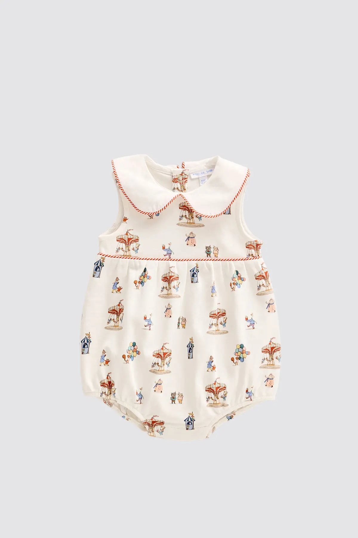 Baby romper with vintage-style print on a light gray background