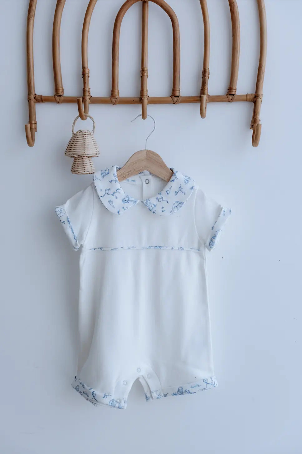 Newborn romper featuring vintage blue Toile de Jouy pattern – breathable and soft cotton