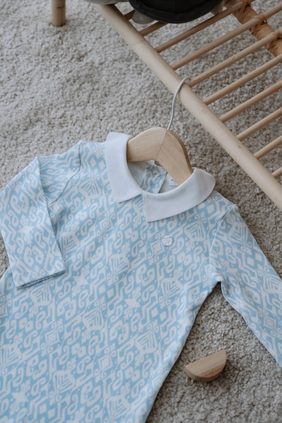 Soft blue footed bodysuit with tribal print