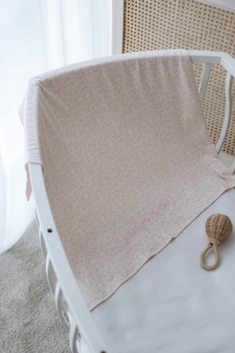 Light pink Ikat print baby blanket by Atelier Babbi USA