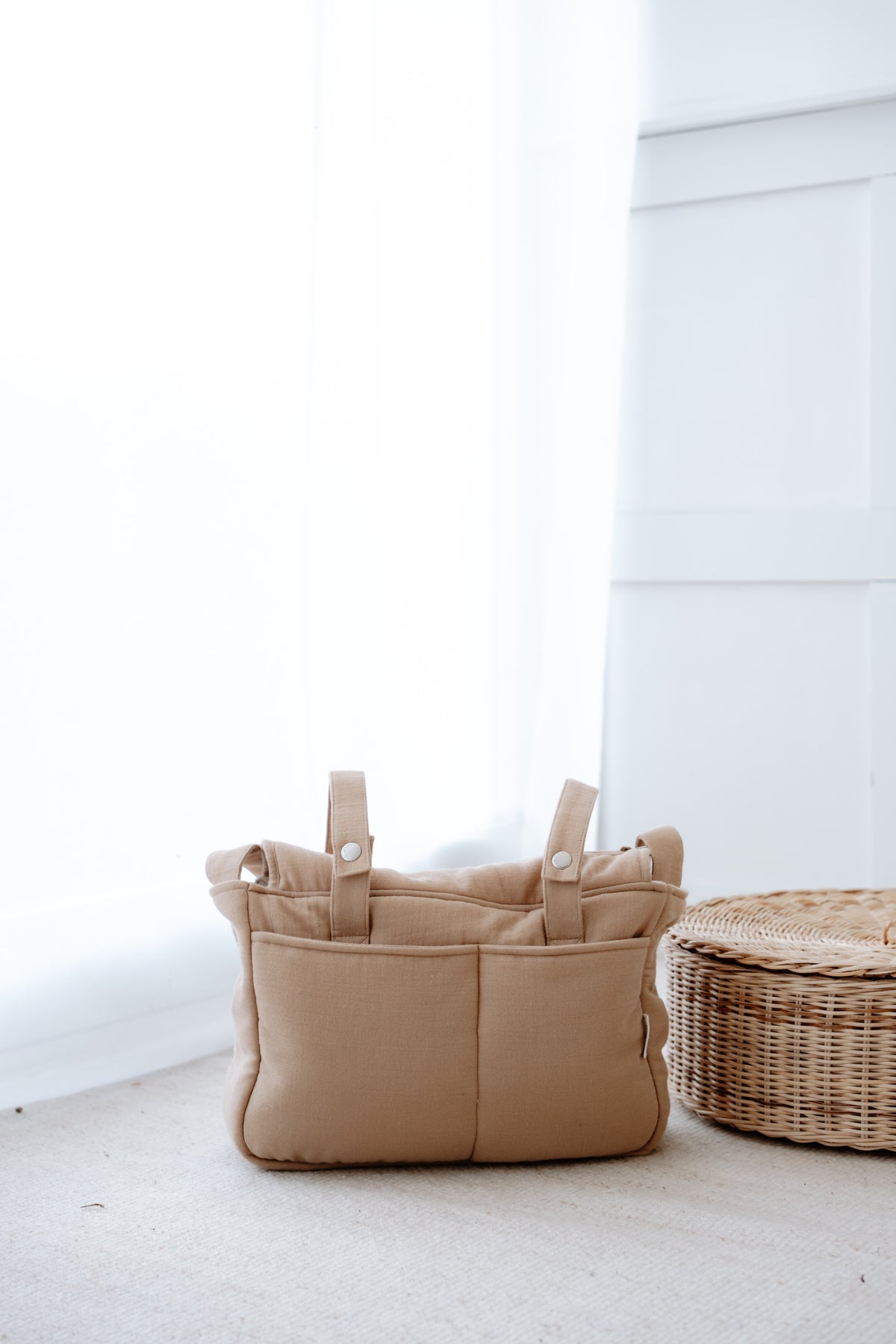 Muslin mommy bag in beige blue color displayed on a white background