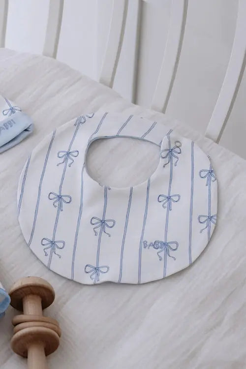 Ribbon/Blue baby bib made from 100% cotton, perfect for newborns and gentle on delicate skin.