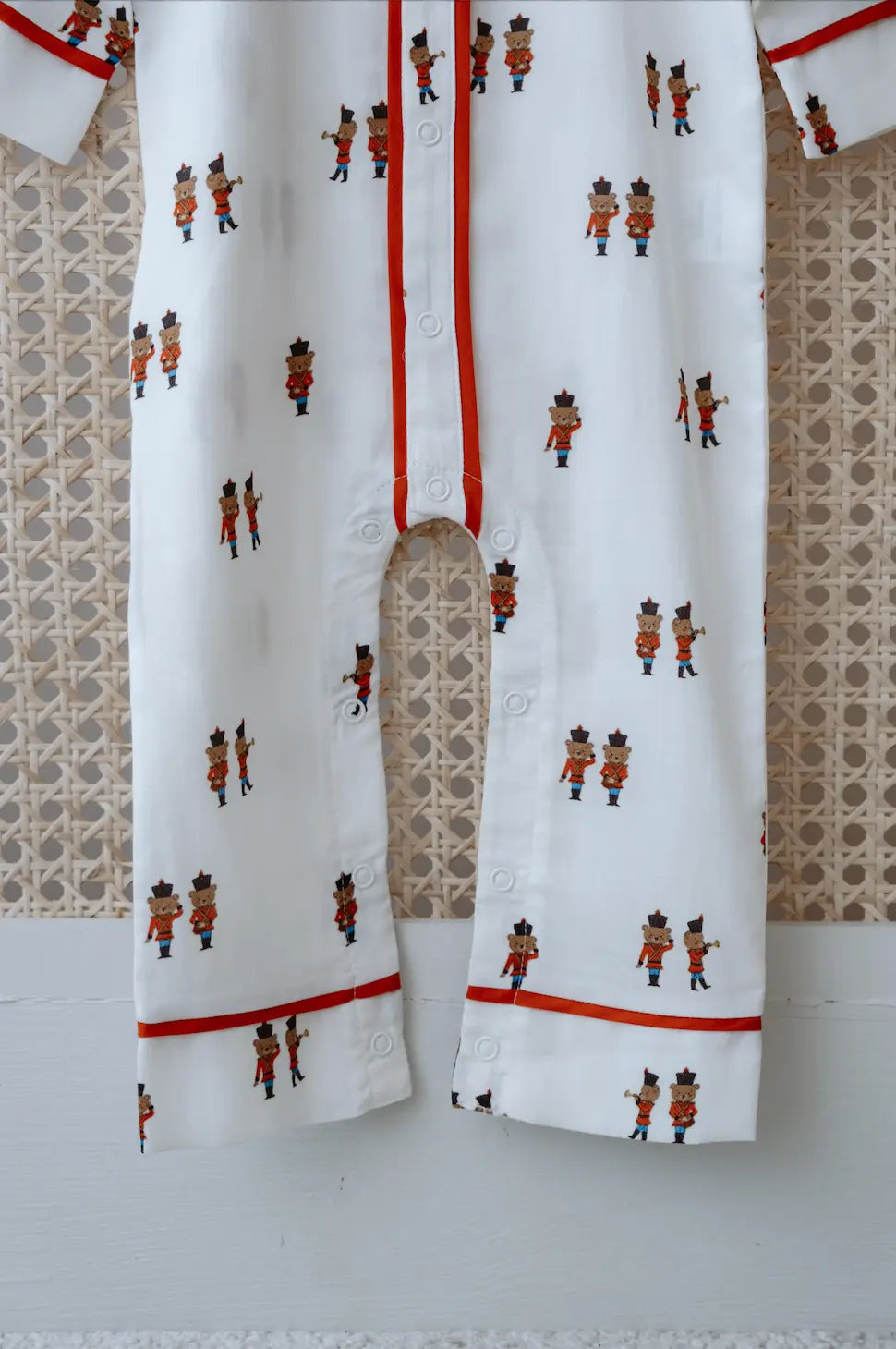 Neutral tone baby jumpsuit with character prints