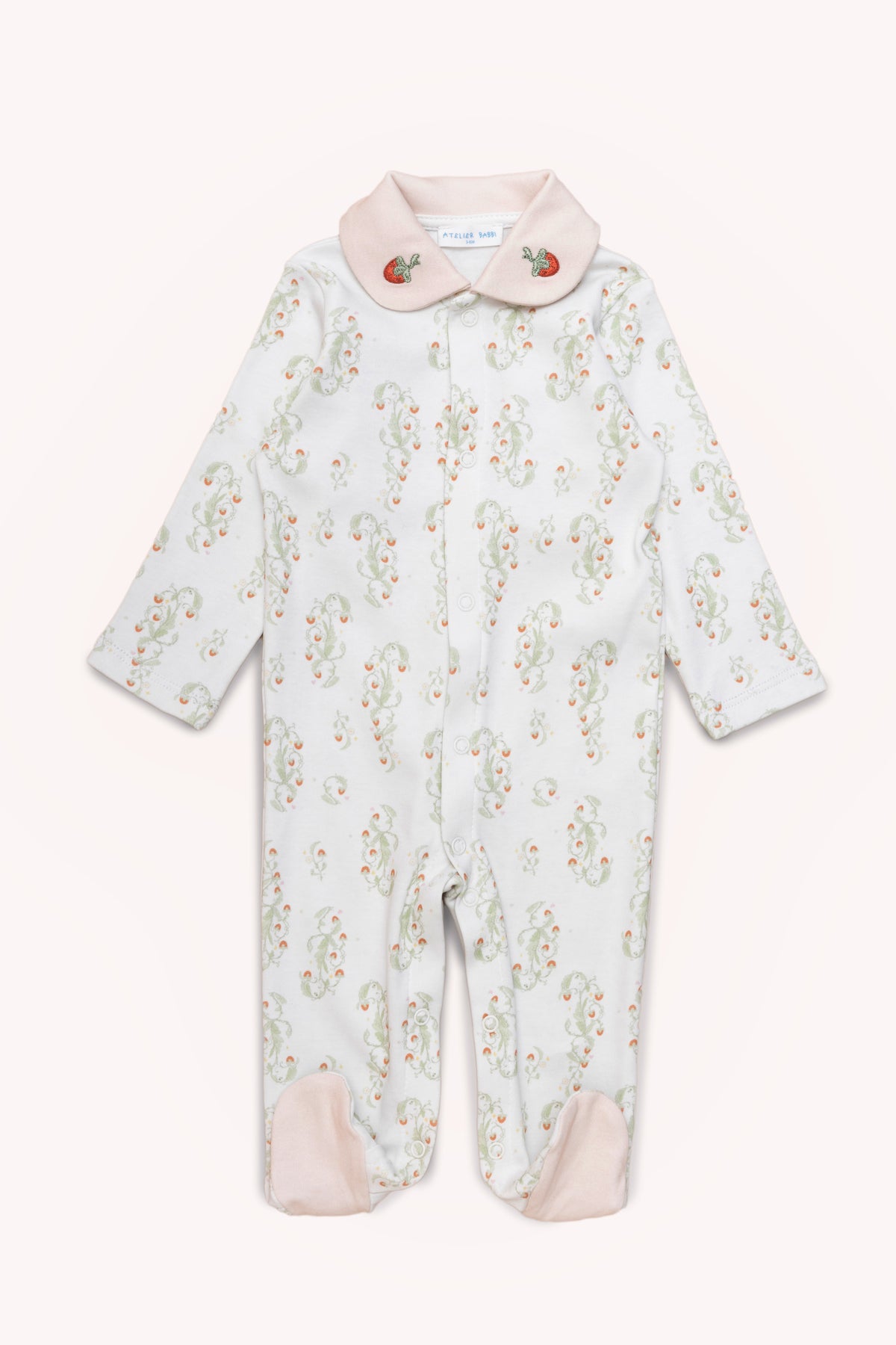 Cozy footed outfit for babies with strawberry print