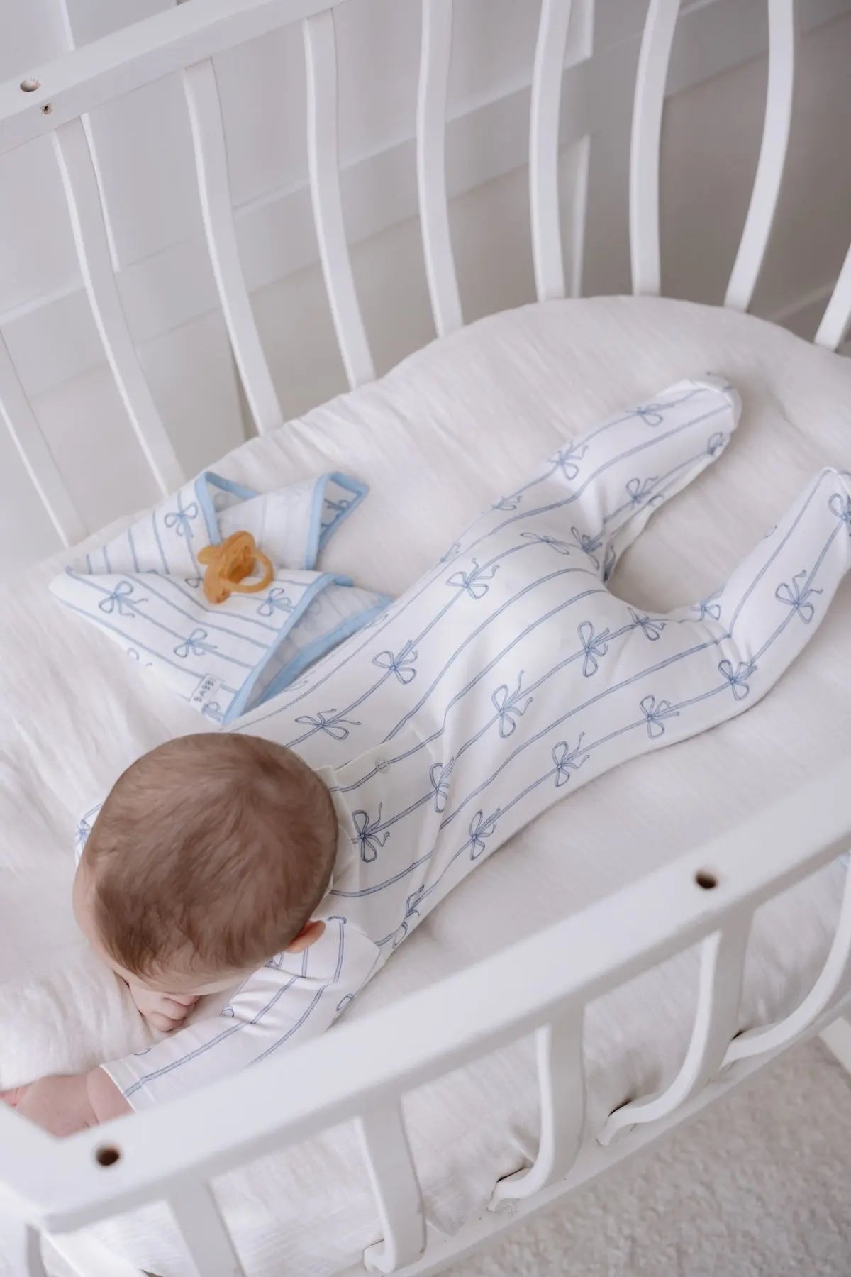 Baby sleeper with blue ribbon detail